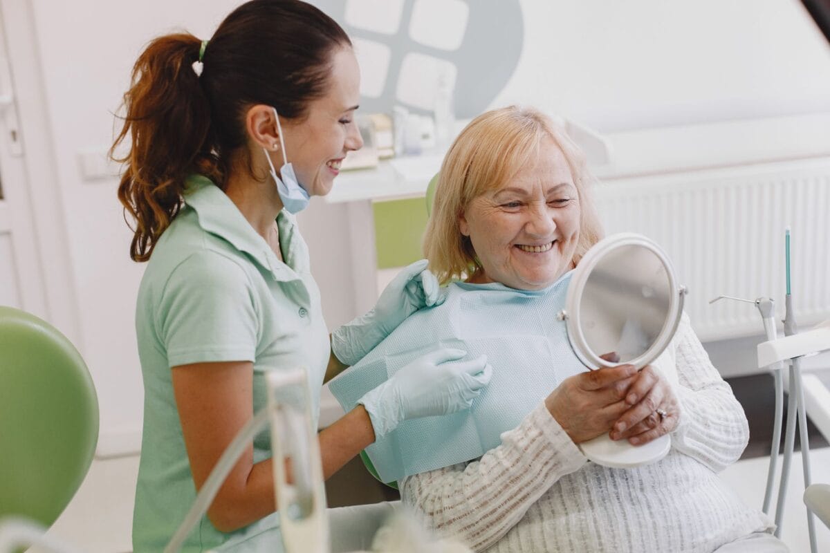 Senior patient smiling at dental check-up - Friendly Dental of Worcester How your smile changes with age